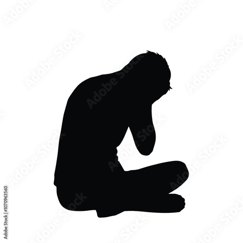 a black silhouette of a person sitting on the ground. The person is sitting with their legs crossed and their head resting on their knees