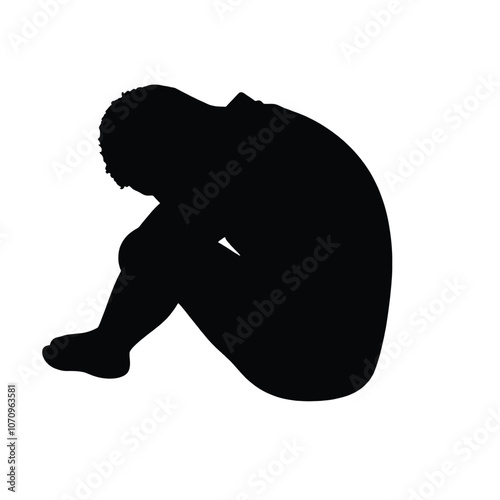 a black silhouette of a person sitting on the ground. The person is sitting with their legs crossed and their head resting on their knees