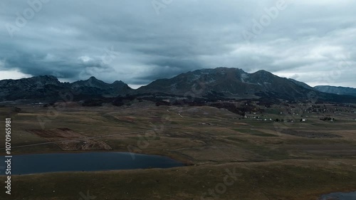 Wallpaper Mural Lake in mountains - a glacial reservoir in Durmitor National Park, Montenegro country. Aerial top view from drone. Calm autumn mountain landscape scene in dusk Torontodigital.ca