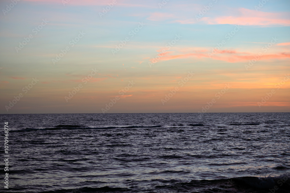 Dramatic red ocean waves at sunset with soft evening sea dark water Dramatic red ocean waves at sunset with soft evening sea dark water