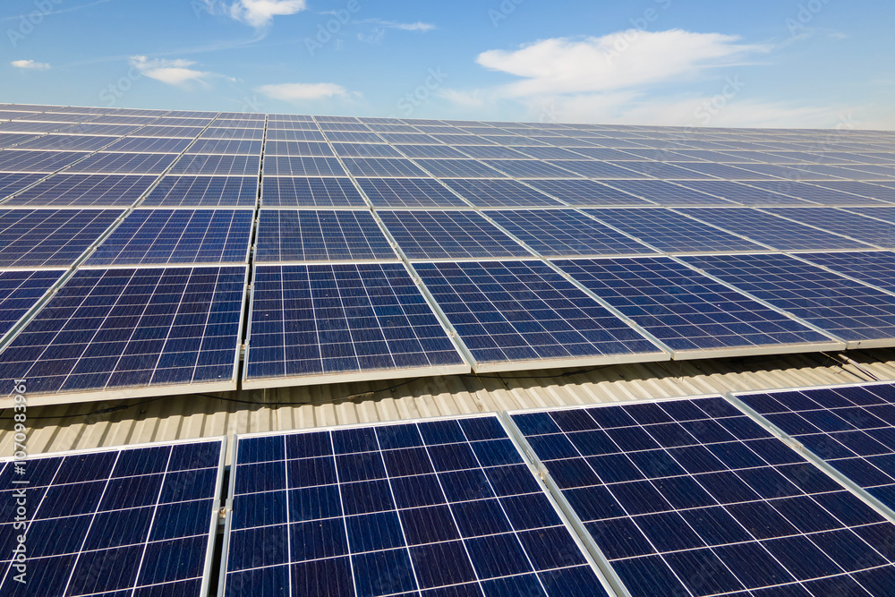 Solar photovoltaic panels installed on building roof for producing clean ecological electric energy. Renewable electricity with zero emission concept Solar photovoltaic panels installed on building roof for producing clean ecological electric energy. Renewable electricity with zero emission concept