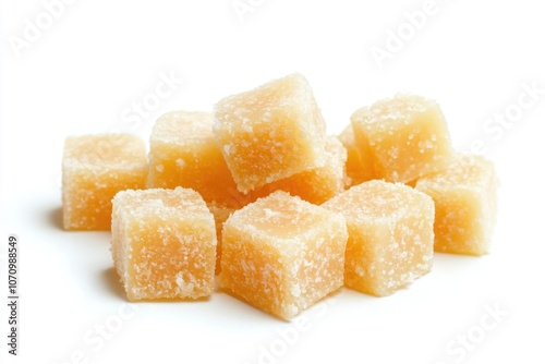 A pile of sugar cubes on a white surface