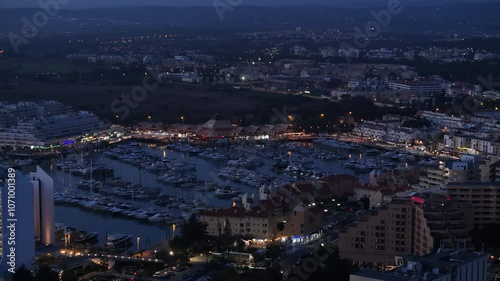 Aerial perspective of Vilamoura marina at night in Algarve, Portugal
