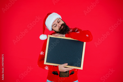 Christmas shopping sale. Happy New Year. Xmas holiday advertisement. Santa Claus man offer New Year sale. Santa man offer holiday shopping. Xmas advertisement, copy space. Sleepy and happy