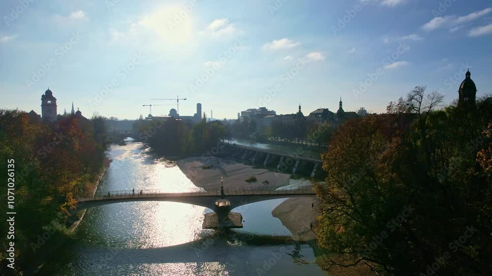 4K Aerial Drone video of beautiful autumn in city center Munich with Isar river, Saint Lukas church, Marienplatz and Maximilianeum on a sunny warm day, Germany