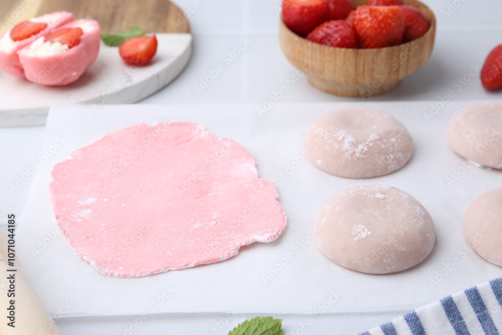 Tasty homemade mochi, dough and strawberries on table, closeup Tasty homemade mochi, dough and strawberries on table, closeup