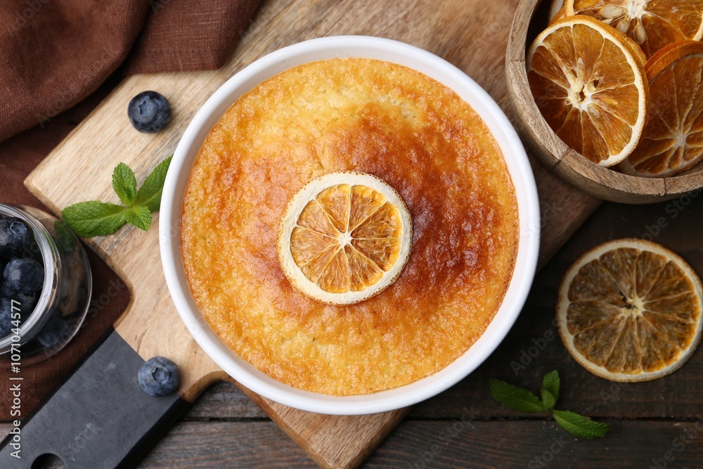 Tasty semolina cake served on wooden table, flat lay Tasty semolina cake served on wooden table, flat lay