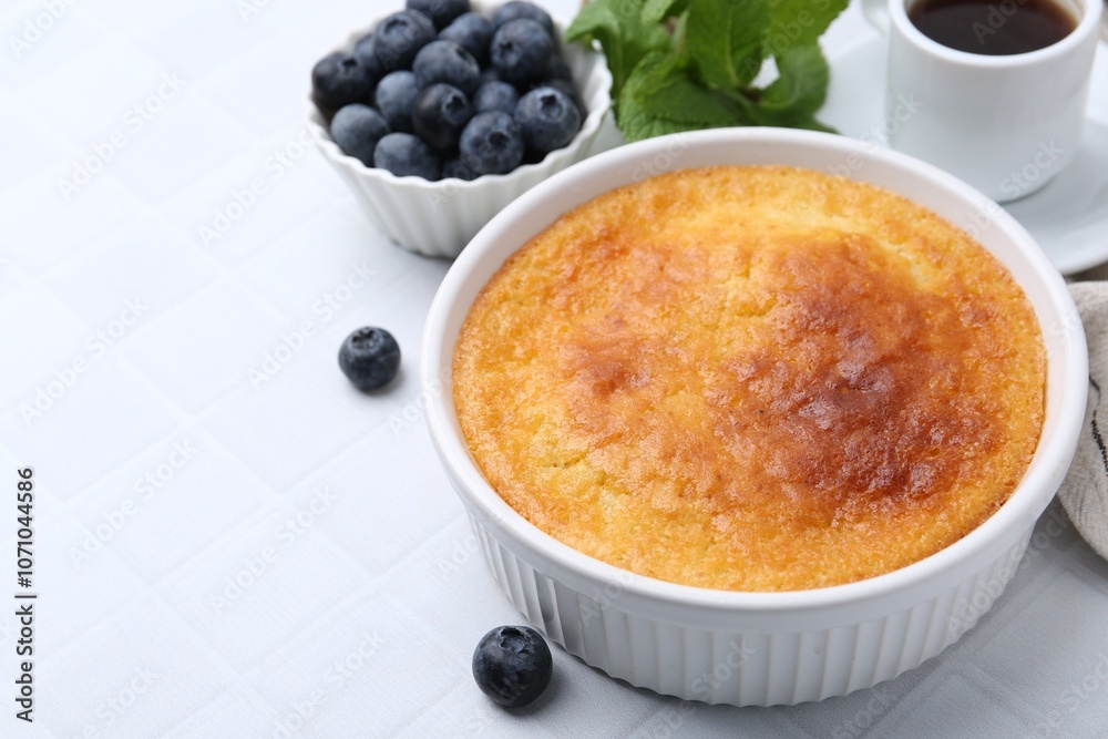 Tasty semolina cake served on white tiled table, closeup. Space for text Tasty semolina cake served on white tiled table, closeup. Space for text