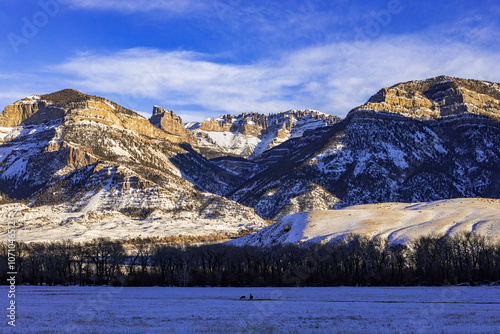 Snow-covered Carter Mountain Rocky Mountain winter landscape at sunset Wyoming, USA.
