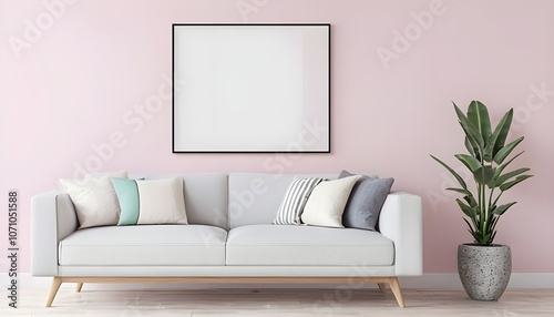 living room The sofa is adorned with three decorative pillows in shades of white, gray, and mint green. Above the sofa, there is a large, vertically oriented rectangular frame with a black border photo