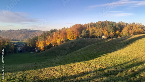 Green fields, hills and meadows. Landscape of Kashubia in autumn. photo