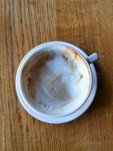 cup of coffee on wooden table