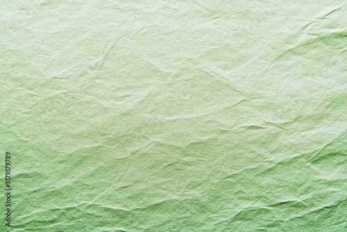 Minimalist serene background with soft pale green gradient on recycled paper texture