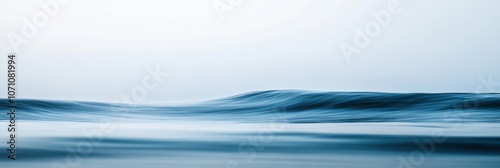 A calm, soft wave of water with subtle reflections and a gentle blue gradient, creating a sense of tranquility on a solid white background