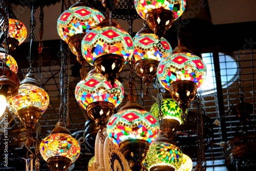 Ottoman style colorful mosaic lamps in souvenir store. Turkish mosaic lamps. Istanbul Grand Bazaar. Turkey. photo