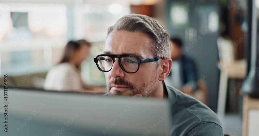 Computer, glasses and reading with business man in office for administration, report or research. Desktop, programming and thinking with mature employee in creative workplace for web development
