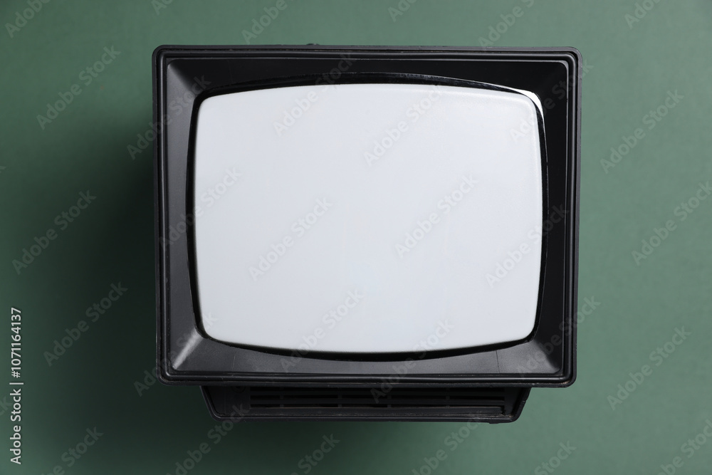 Retro tv set on green background, top view Retro tv set on green background, top view