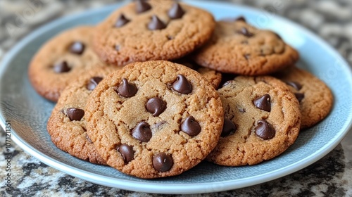 A plate of freshly baked chocolate chip cookies. (6)