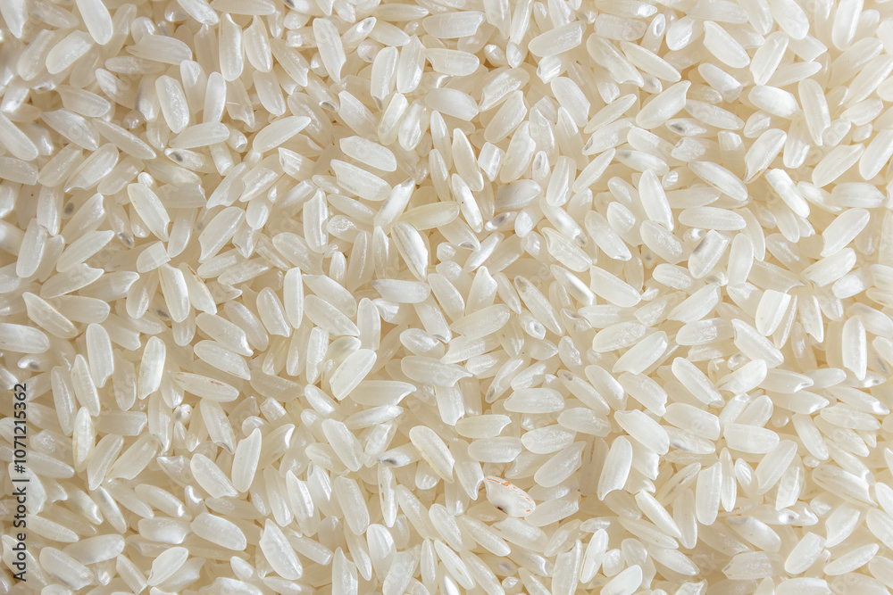 Dry Uncooked White Rice Background - Top View, Flat Lay. Scattered Raw Long Grain Rice. Asian Cuisine and Culture. Healthy Eating Ingredients. Diet Food Dry Uncooked White Rice Background - Top View, Flat Lay. Scattered Raw Long Grain Rice. Asian Cuisine and Culture. Healthy Eating Ingredients. Diet Food