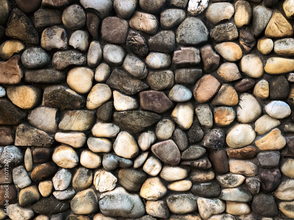 Background of masonry round stones on the surface Background of masonry round stones on the surface