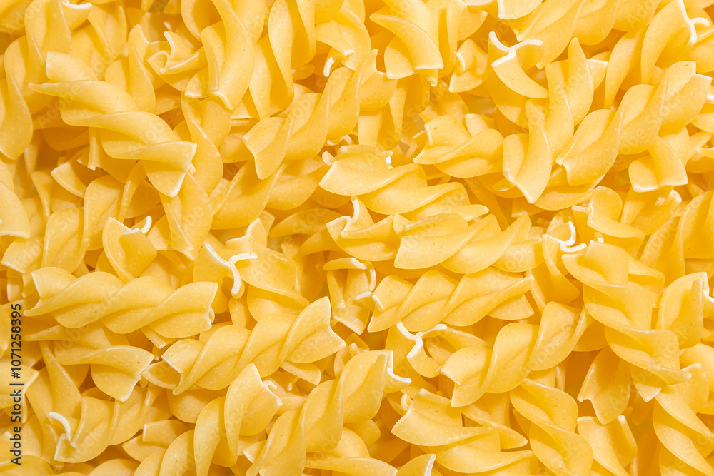 Uncooked Fusilli Pasta: A Culinary Canvas of Spiral Macaroni, Creating a Lively and Textured Background for Gourmet Cooking. Dry Pasta. Raw Macaroni - Top View, Flat Lay