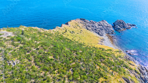 Photo of a group of islets off San Carlos Sonora, Mexico. Its surface full of desert sahuaros generate an iconic contrast with the sea. 
 photo