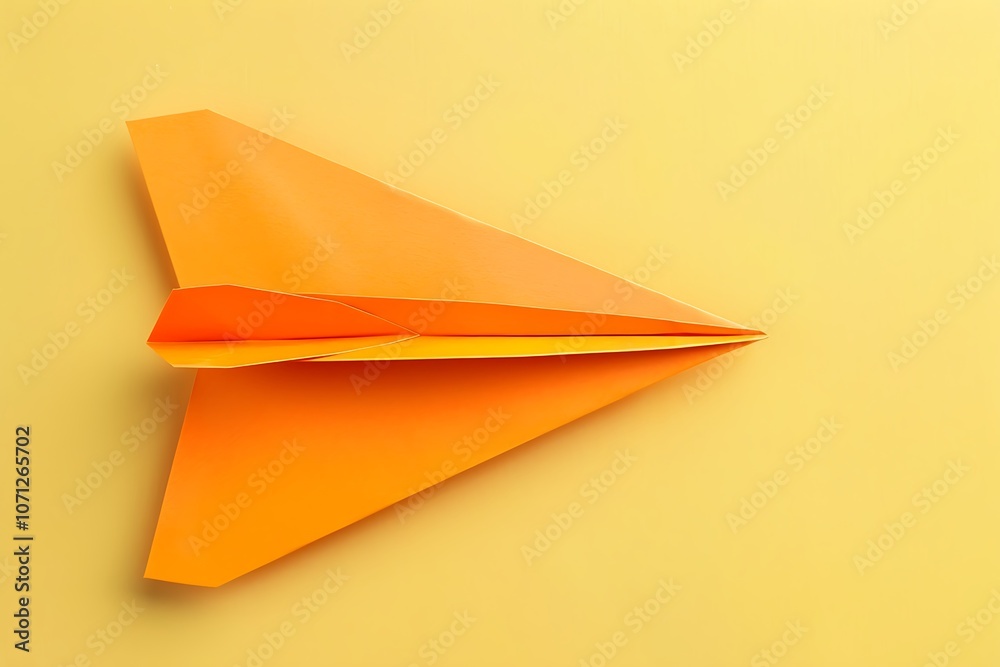 Paper plane isolated on orange background Paper plane isolated on orange background