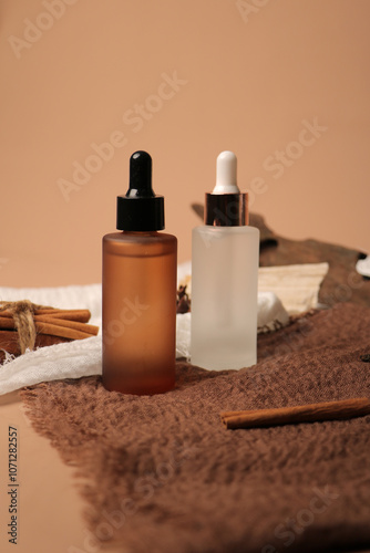 Amber and Frosted Glass Dropper Bottles for Skincare with Natural Elements photo