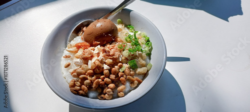 chicken porridge with chocolate egg on top photo