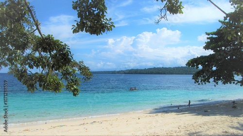 Blue sky day in Pasir Putih Manokwari, Papua, Indonesia. A beautiful quiet beach, only the sound of wave is heard, bright blue sky, full of memory