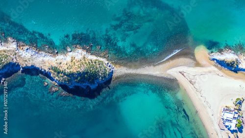 Overhead view of an island full of sahuaros off San Carlos Sonora, Mexico. Its endemic vegetation and rocky surface create an iconic contrast with the sea.  photo