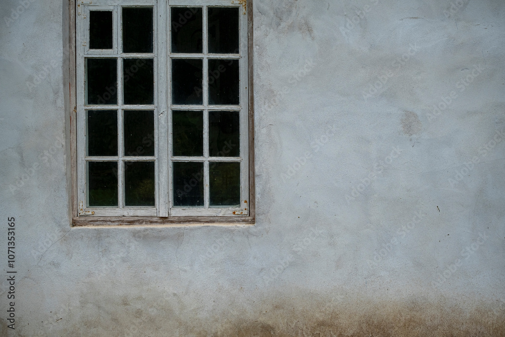 Old church window on the cracked white wall Old church window on the cracked white wall