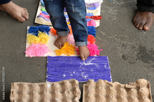 Therapy for children, also known as sensory stimulation, children stepping on wool, a process that helps children develop their cognitive and psychomotor abilities. photo