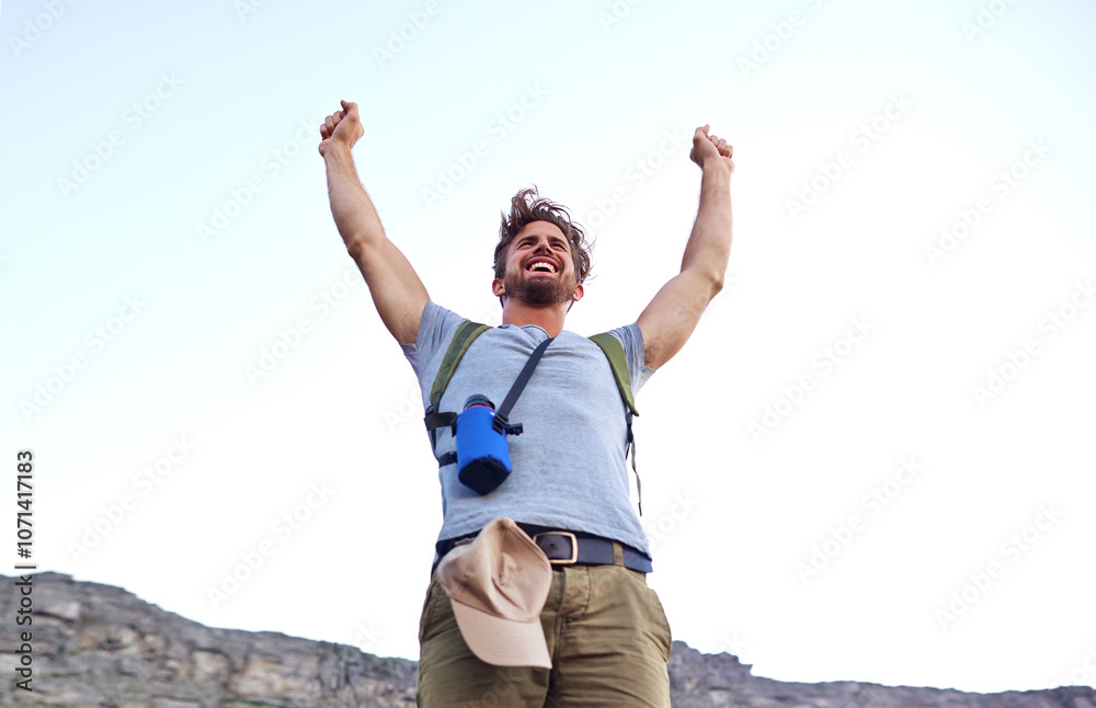 Man, happy and celebration with hiking on mountain for fitness adventure, freedom or travel goals. Victory fist, person and excited on hill for trekking achievement, workout challenge or mockup space Man, happy and celebration with hiking on mountain for fitness adventure, freedom or travel goals. Victory fist, person and excited on hill for trekking achievement, workout challenge or mockup space