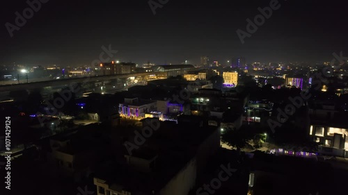 Wallpaper Mural aerial drone shot panning over a group of lit densely populated houses with multicolor lights showing the celebration of the festival of lights diwali, new year, christmas Torontodigital.ca