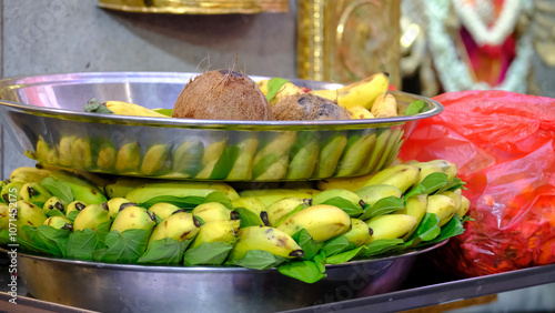 Bananas and whole coconuts are neatly arranged on the temple altar as offerings during the Deepavali festival celebration in Little India, Singapore.