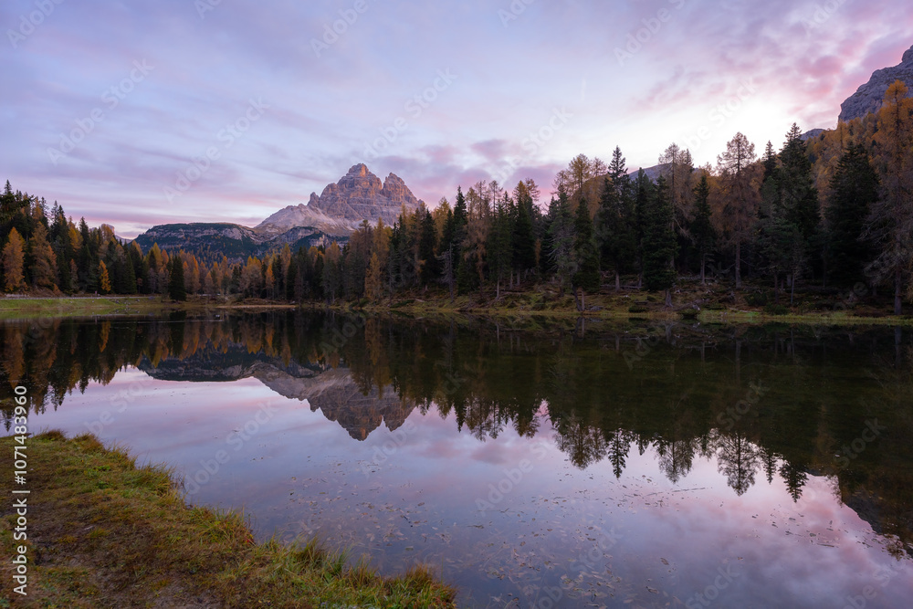 Fototapeta premium Stunning landscape and Tri Cime reflection of Antorno lake in autumn, Dolomite Italy.