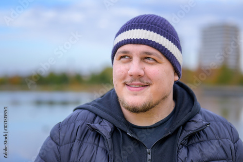Smiling Young Man in Beanie Outdoors