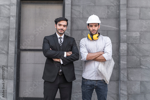 Obraz na płótnie Project engineer and young businessman make high five for success business deal at outdoor office building project. w salonie