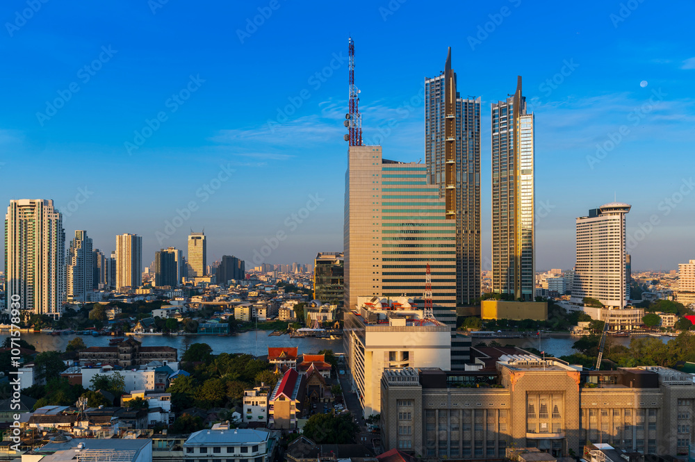 Modern Skyscraper of business center district at Bangkok skyline with blue sky background, Bangkok city is modern metropolis and favorite of tourists of Thailand