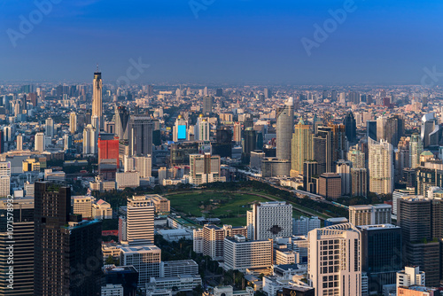 Modern Skyscraper of business center district at Bangkok skyline with blue sky background, Bangkok city is modern metropolis and favorite of tourists of Thailand photo