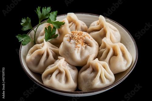 An isolated shot of a bowl filled with steamed dumplings photo