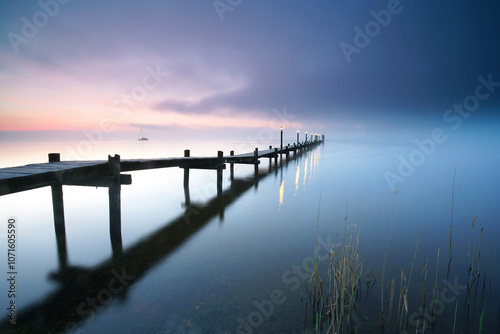 Wallpaper Mural long wooden pier over the calm sea, tranquil morning with beautiful sunrise, peaceful and quiet Torontodigital.ca