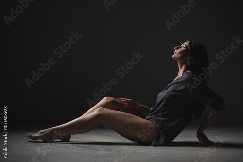 Silhouette of Woman in Thoughtful Pose with Shadows