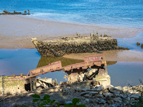 Rusted Shipwreck on a Sandy Beach, Lanester-Kerhervy, Brittany photo