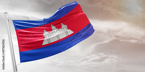 Cambodia national flag cloth fabric waving on beautiful grey Background.