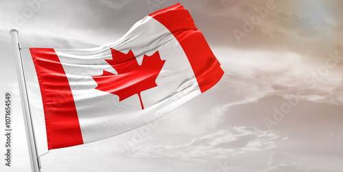 Canada national flag cloth fabric waving on beautiful grey Background.