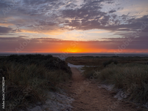 Sundown at Schiermonnikoog nature beach and sea in the Netherlands