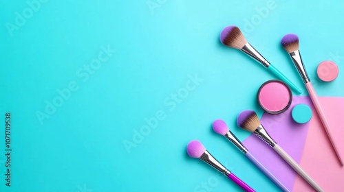 Colorful makeup brushes and powders arranged artistically. photo