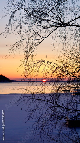 Winter sunset on the lake Saimaa photo